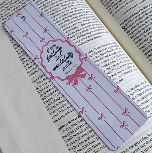 Pink Christian aluminum bookmark with bows and Psalm 139:14 scripture reading “I am fearfully and wonderfully made.”